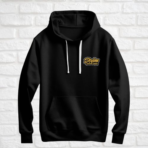 Black hoodie with a yellow logo on a white brick wall background